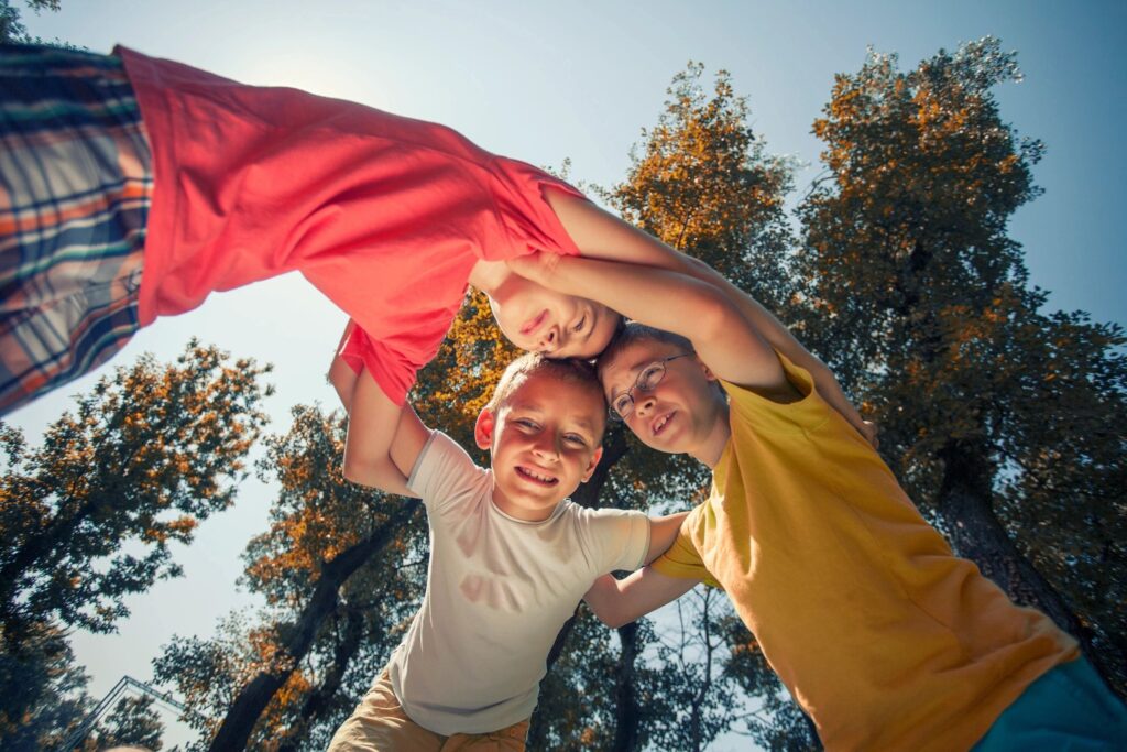 three boys playing child adolescent chronic pain